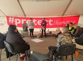 Kalaya’an Mendoza Co-facilitating a training with Te’Ao Pritchard during the Occupation of Ihumātao in Aotearoa/New Zealand (2019)